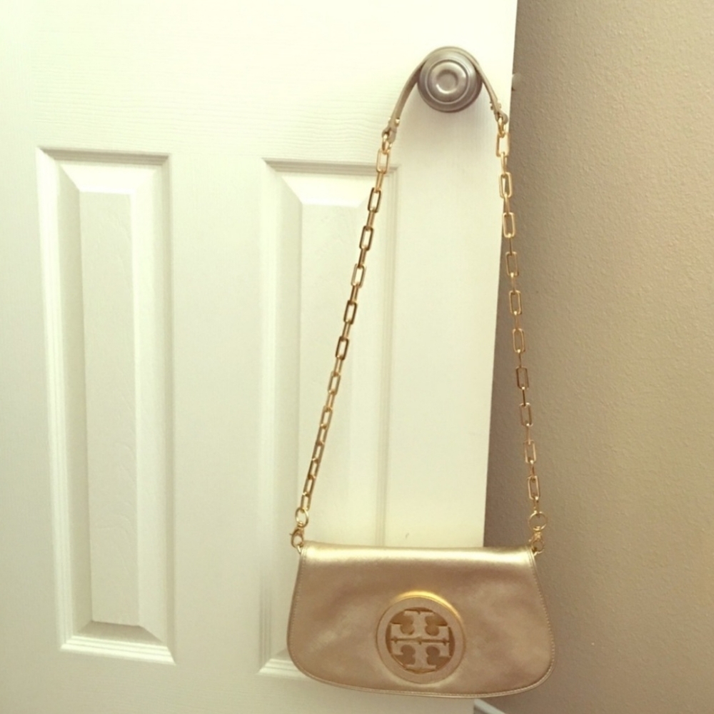 Tory Burch Gold Crossbody or clutch bag.
